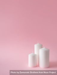 Christmas candles on pink background bxwrr4