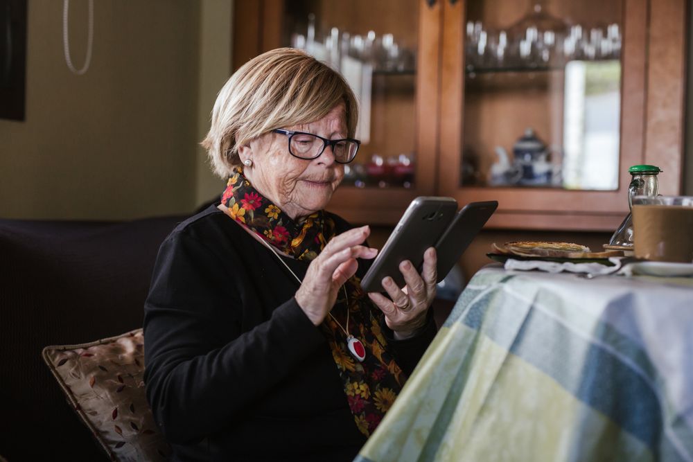 Older woman looking in smartphone