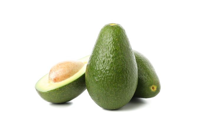 Ripe fresh avocado isolated on plain background