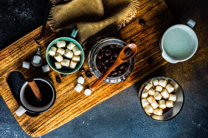 Cups of delicious coffee with sweet garnishes