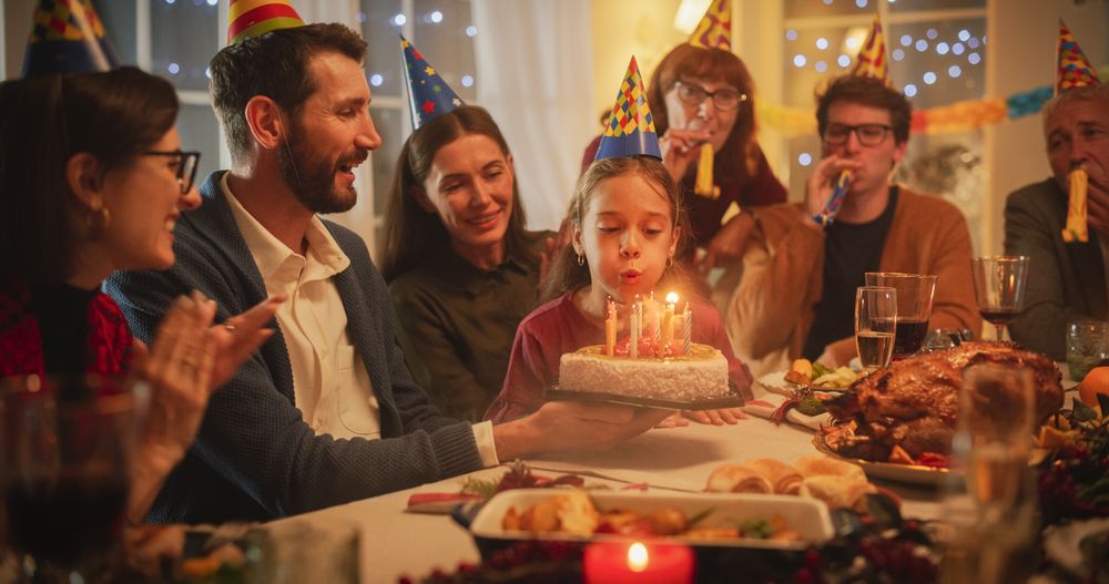 Family Celebrating Birthday with a Young Girl.