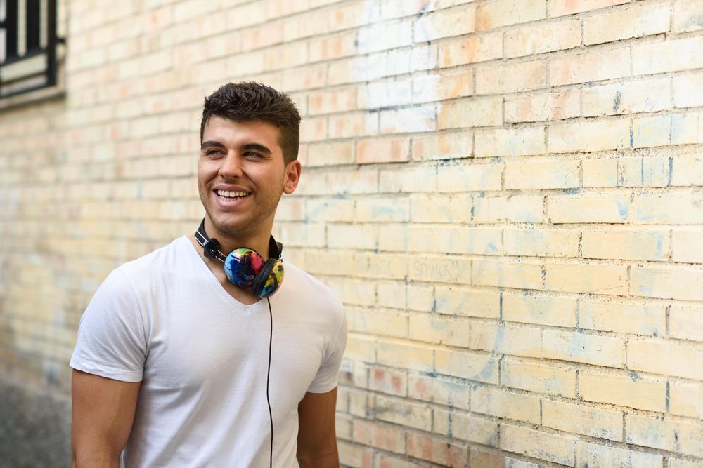 Portrait of happy young man with headphones