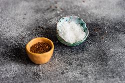 Two small bowls of flax seeds and salt