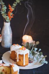 Spring Easter tablescape with cake, candles, and florals