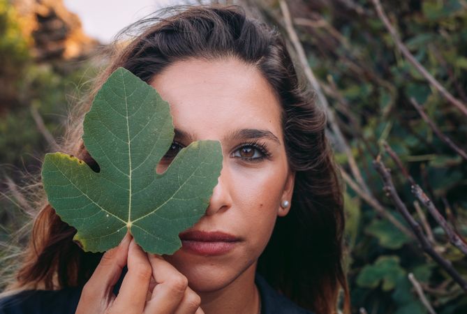 Resting woman walking in nature and enjoying in leaf