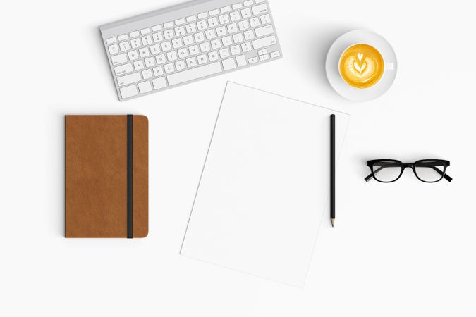 Modern workspace with coffee cup, smartphone, paper, notebook and tablet copy space