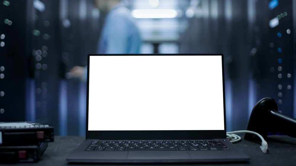 Laptop with Screen on It Stands on The Table.