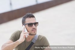 Male talking on cellphone, copy space bD1KA0