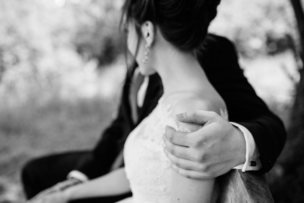 Grayscale photo of bride and groom