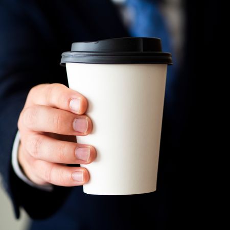 mock up coffe cup with hand
