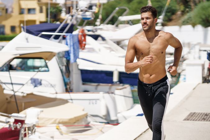 Male jogging on waterfront