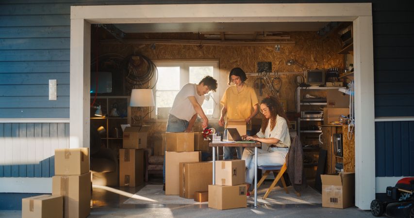 Diverse Small Business Partners Working in Home Garage.