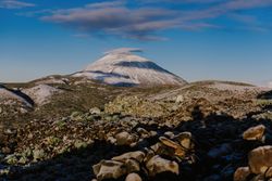 Clouds near snowy mountain