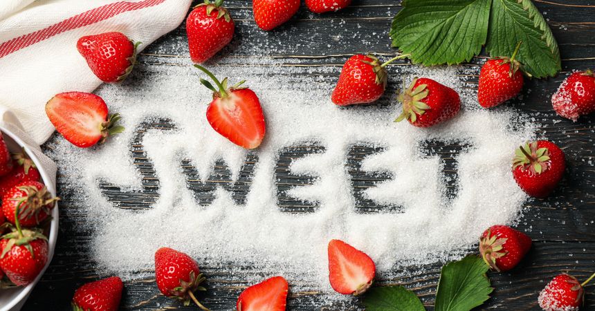 Word Sweet made of sugar, and strawberry on wooden background, top view. Summer berry