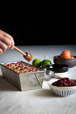 Crop hands putting cheesecake on table