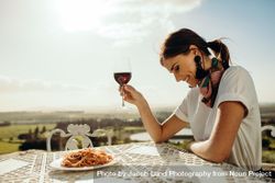 Close up of a woman dining out sitting at a restaurant table 49y6W4