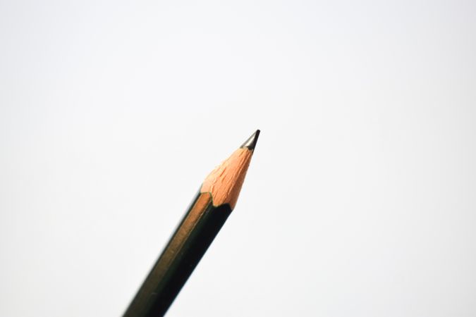 Close up of sharpened pencil in center of picture with copy space