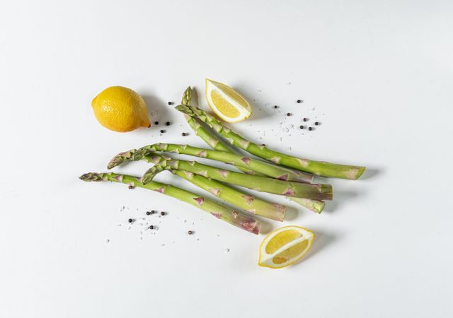 Asparagus with lemon wedges salt and pepper
