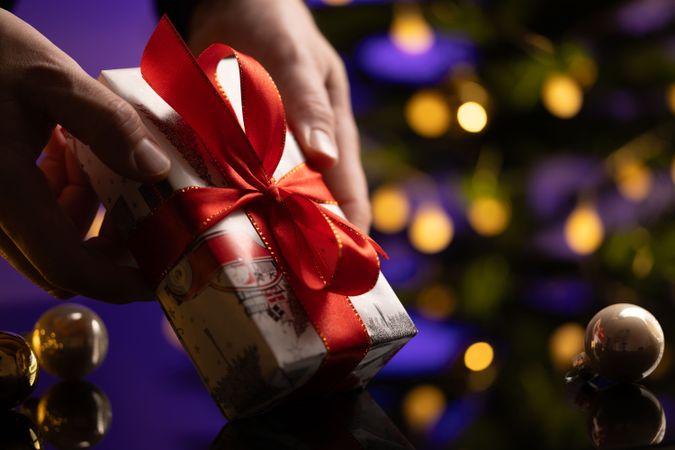 Man Giving Gift Christmas Tree
