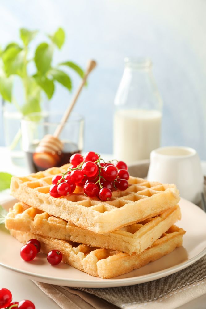 Beautiful composition with sweet belgian waffles, space for text