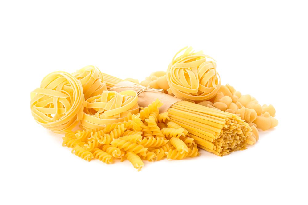 Pasta isolated on bright background. Uncooked whole wheat pasta