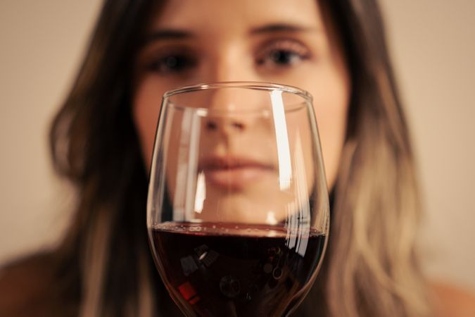 Woman behind wine glass alcohol addiction awareness mental health depression loneliness problem drinking dark