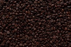 Layer of coffee beans flat lay