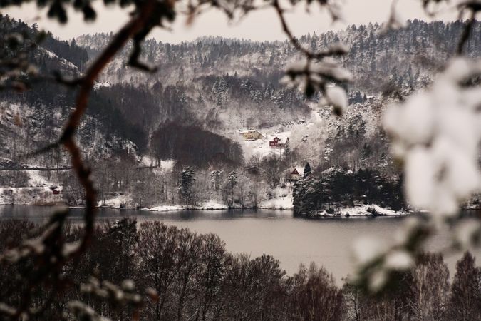 Snowy peaceful mountain valley at shore