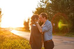 Girlfriend and boyfriend about to kiss at sunset