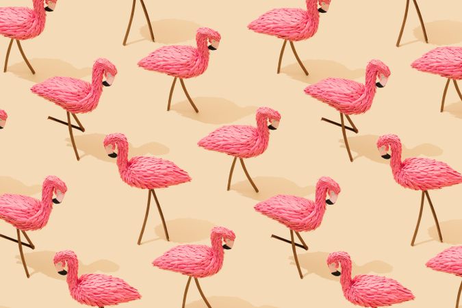 Pink flamingos pattern on beige background