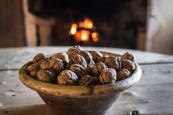 Bowl of nuts on table in old cottage