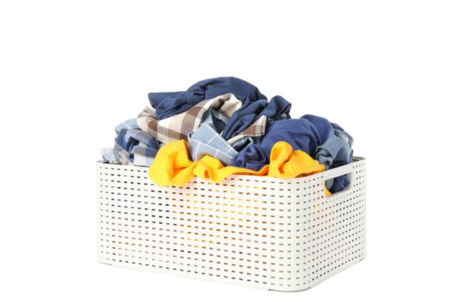 Basket with clothes isolated on blank background