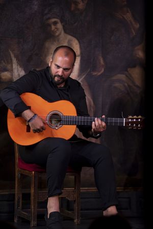Man playing guitar on stage