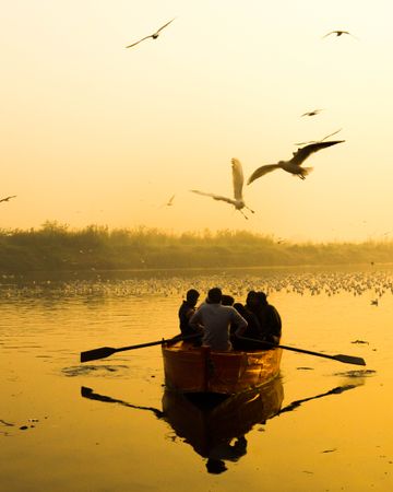 Men riding paddle boat