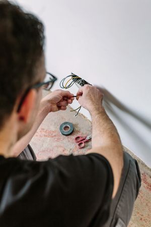 Electrician working on the electrical installation of a house