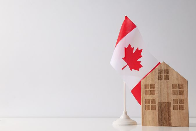 A wooden house with the flag of Canada