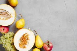 Fruit on grey table with copy space
