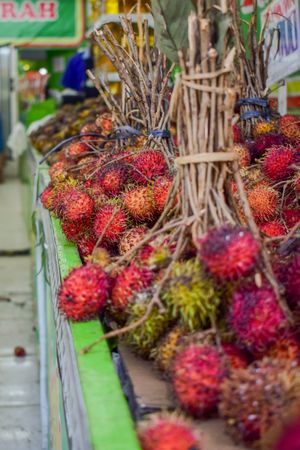 Bunch of lychee fruits for sale in market
