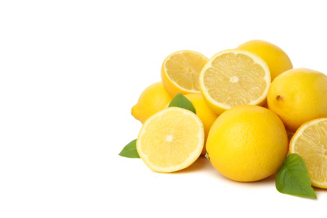 Fresh lemons isolated on bright background. Ripe fruit