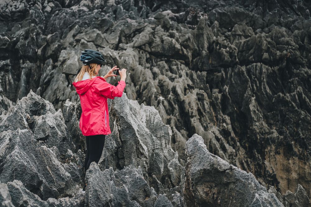 Female taking photos on cliffs