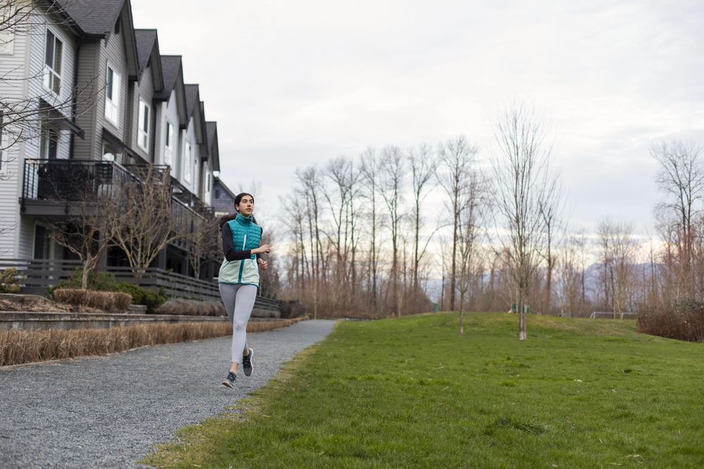 Young female running in the morning hours