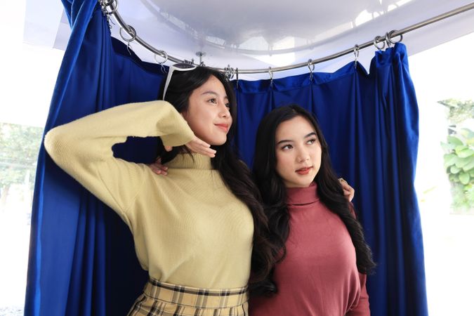 Young  Asian Girl doing Photoshoot at the Blue Photobooth Stand