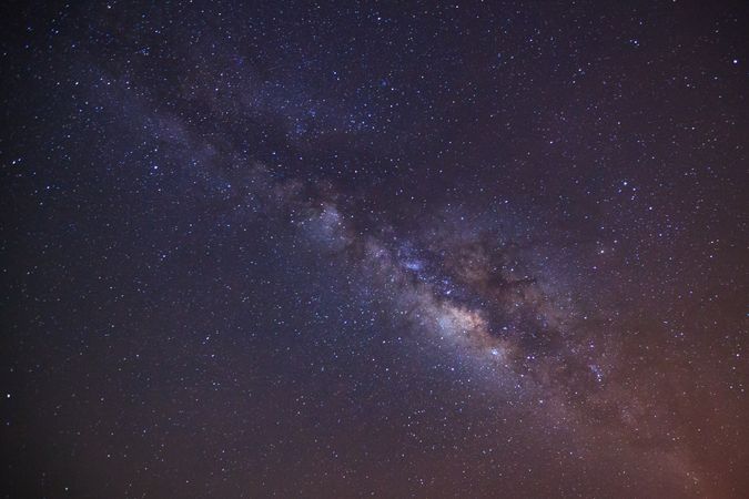 milky way galaxy with cloud and space dust in the universe, Long exposure photograph, with grain.