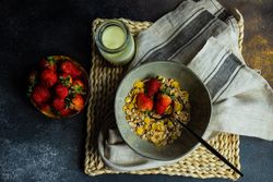 Top view of bowl of cereal with strawberry