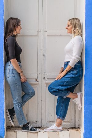 Positive women standing in doorway