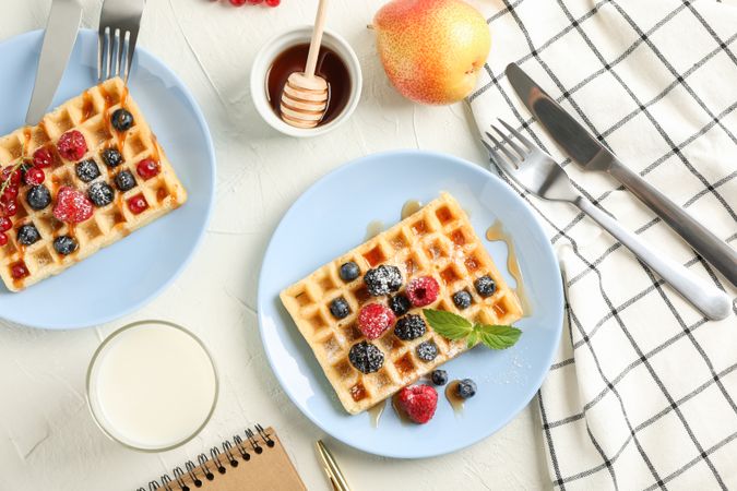 Composition of breakfast with belgian waffles, top view