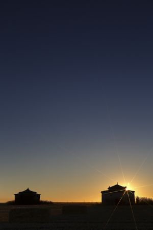 Aged house in rural countryside under starry sky