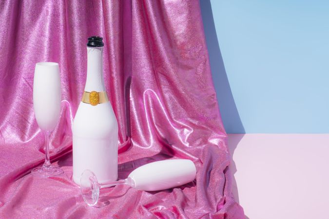 Holographic abstract pastel colors backdrop with Champagne bottle, horizontal composition