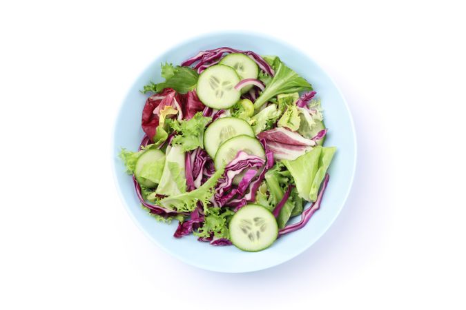 Plate with fresh salad isolated on blank background