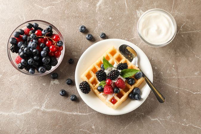 Composition of breakfast with belgian waffle, space for text